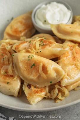Homemade Pierogi with onions and sour cream