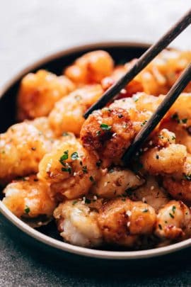 Picking up bang bang shrimp with chopsticks