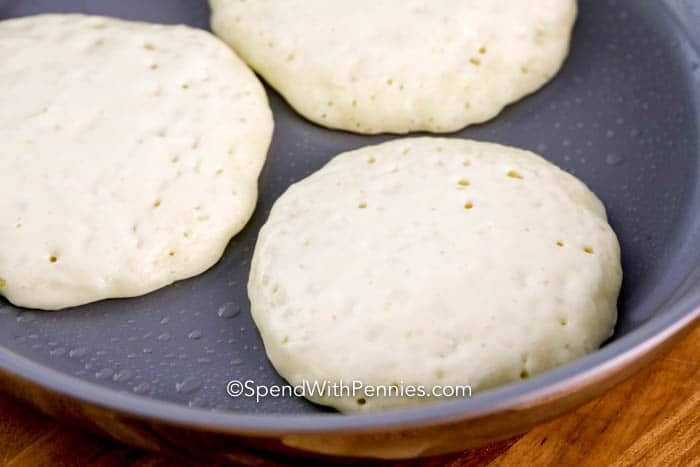 Pancakes being cooked in a frying pan