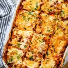 pan of the best baked homemade lasagna on a white plate