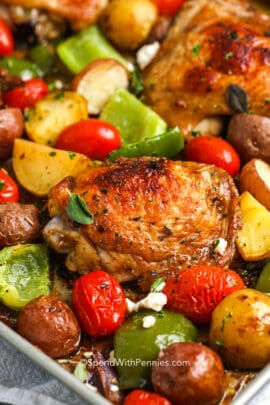 Baked chicken, onions, potatoes, peppers and tomatoes topped with feta cheese and herbs