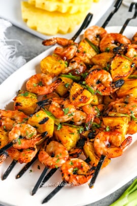 shrimp kabobs piled on a plate