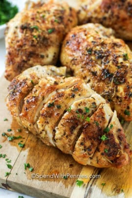 Split chicken breast on a wooden board